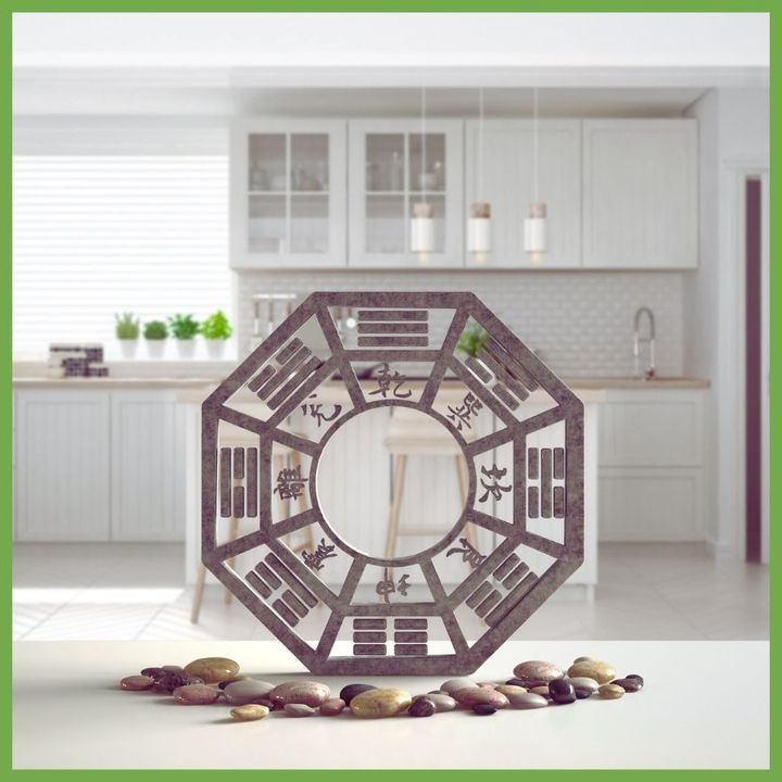 Bagua mirror standing in a white kitchen