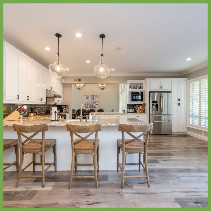 Bright kitchen with an island and three stools